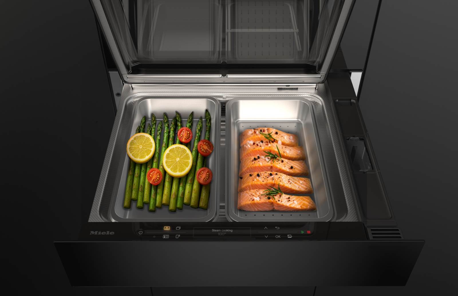 Geöffnete Miele Dampfgarschublade mit Gemüse und Lachs